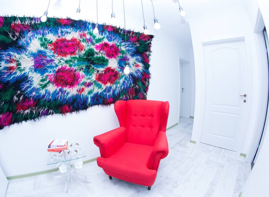 One of the most transylvanian spot of the apartament is this colorfull Cerga- a sheep blanket colored by hand. You can always see them in transylvanian houses. How about relaxing and reading a book in this awesome armchair?