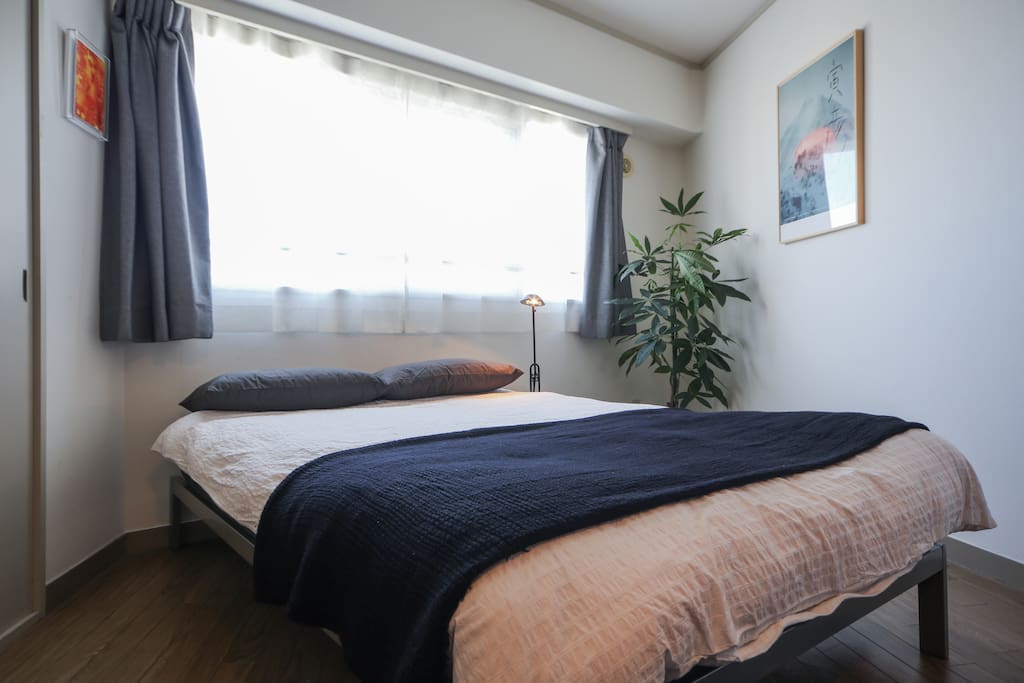 Brightly-lit room with a semi-double bed and a real mattress
