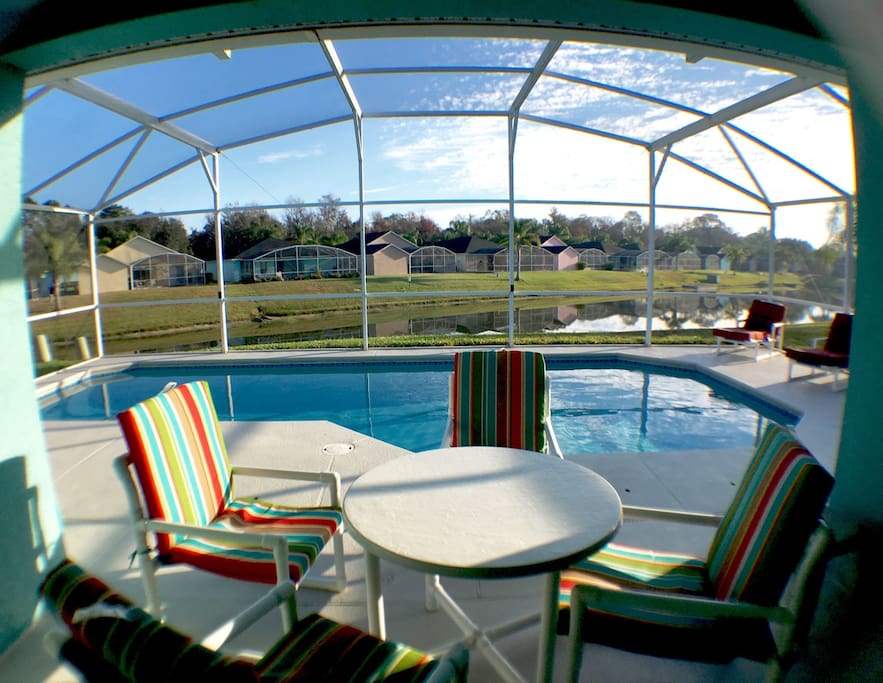 A fully screened in pool / dining area.