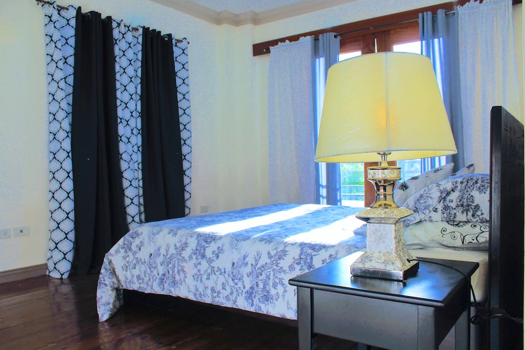 Sophisticated Master’s Bedroom
with private balcony and Queen size bed
