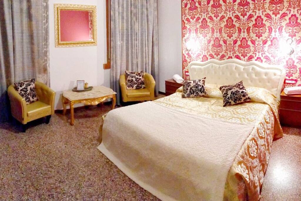 red bedroom with marble table