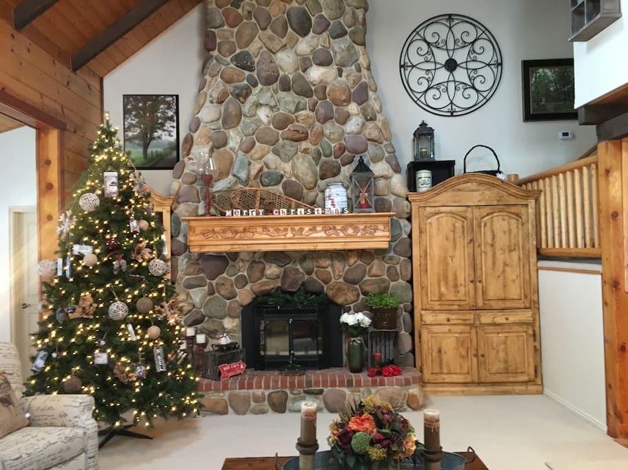 A grand wood-burning fireplace, the crowning glory of the cabin.