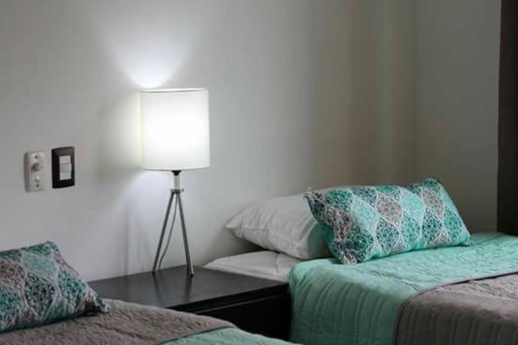 2 twin beds , air conditioner, closet and balcony