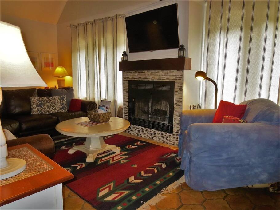 Cozy Living Room with Wood Fireplace with satHDTV