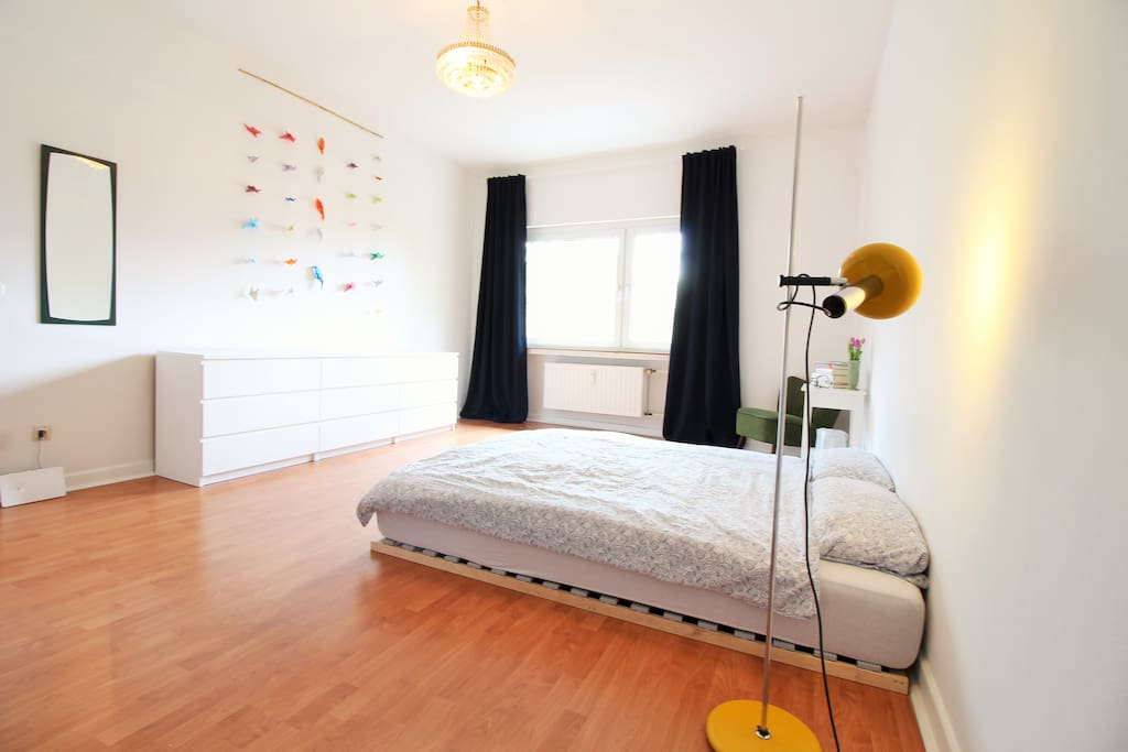 The bright and friendly bedroom with a clean and stylish furniture.