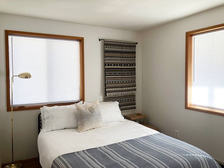 The Blue Room is on the main floor with a queen bed and two windows, it's bright through the day. There is a full bath right next door.