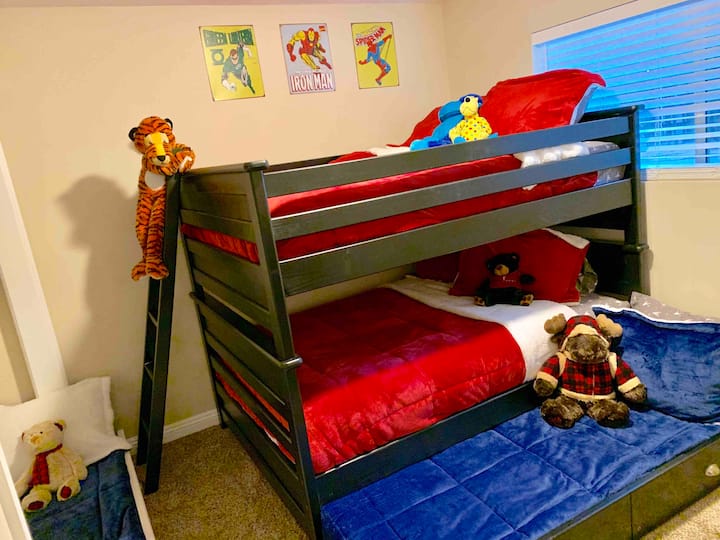 Downstairs room with two full bunk beds and two twin beds. 