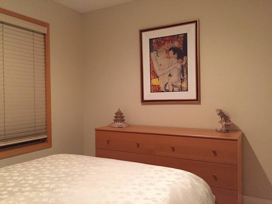 bed room with pictures and wardrobe and closet