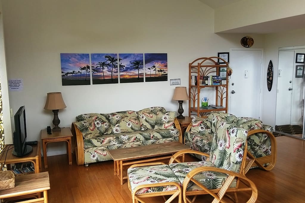 View of the living room. Nice decor with island style furniture and the couch is a queen size sofa bed. Very comfortable and chill. Relax fam