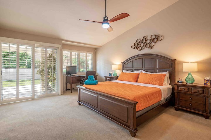 Large luxurious primary bedroom with dual vanity ensuite bathroom