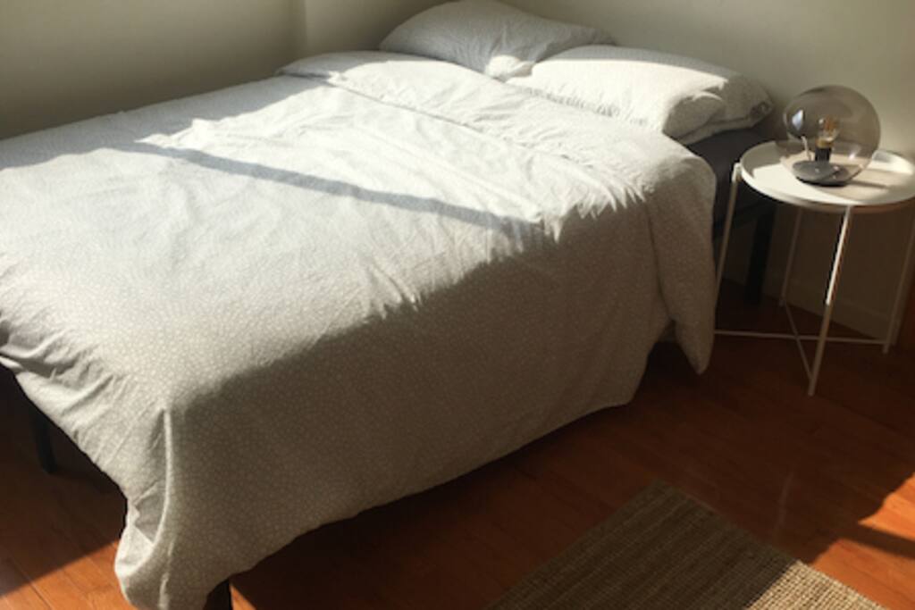 Bright, clean, and modern bedroom.