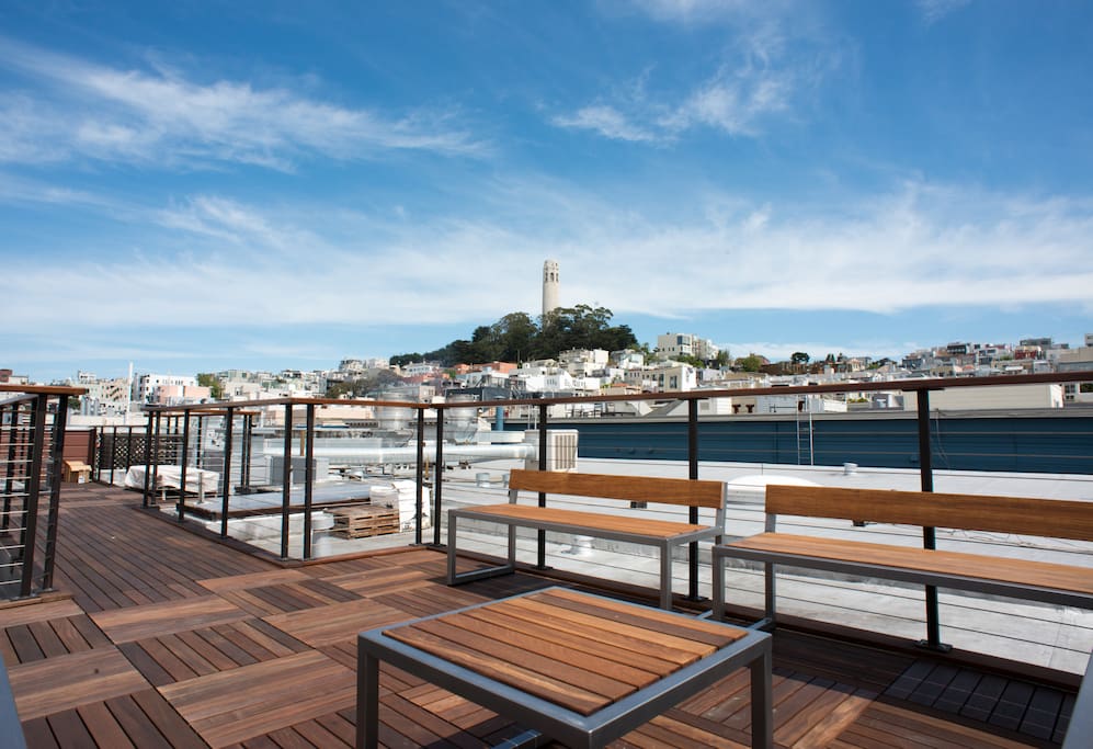 Private rooftop deck with views of iconic city landmarks- Coit Tower.