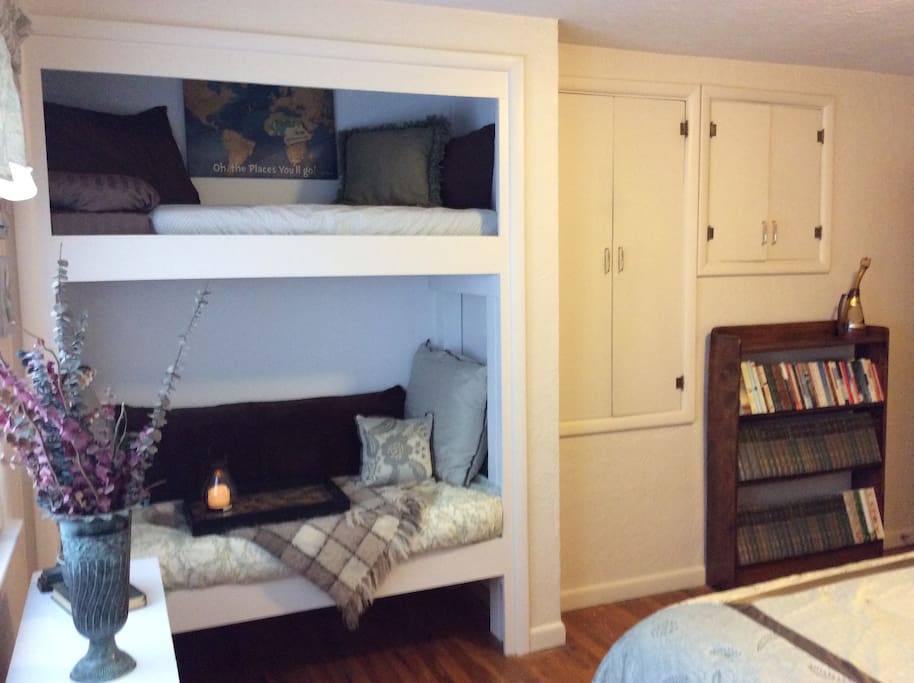 Day bed with top bunk built-in. Excellent place for an adult to read and relax or pull out the folding table and work. (Built for children, but a small
5'5" adult can stretch out fully on bottom bed.)