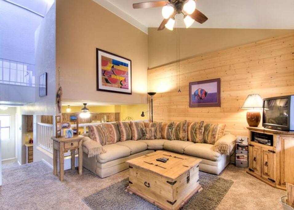 Large comfy family room ready for nightly 'smores in the wood burning fireplace.