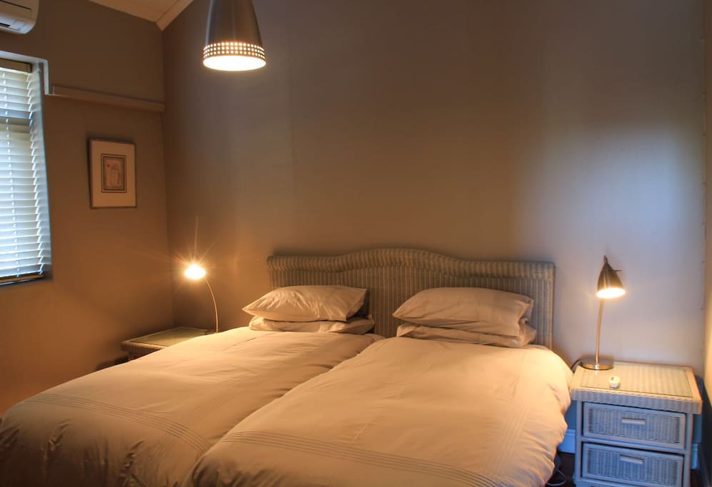 main bedroom with luxurious linen, air-conditioning and electric blankets