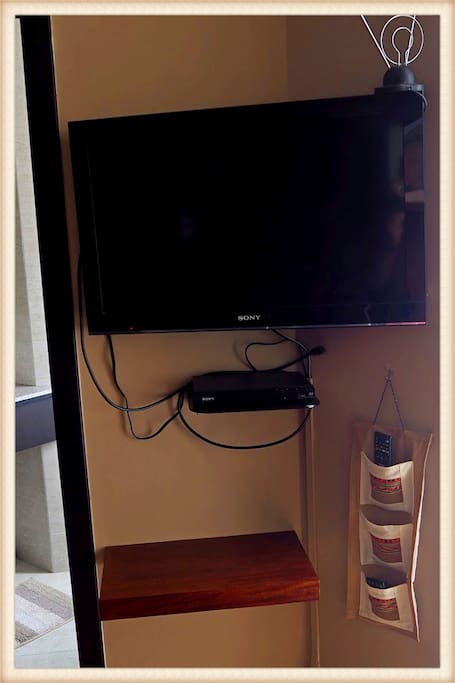 TV and DVD player. TV has HDMI cable and a custom shelf to place your laptop to attach to the cable.