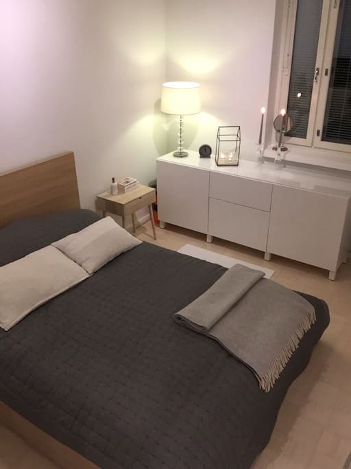 The bedroom is spacious and has a comfortable double bed.