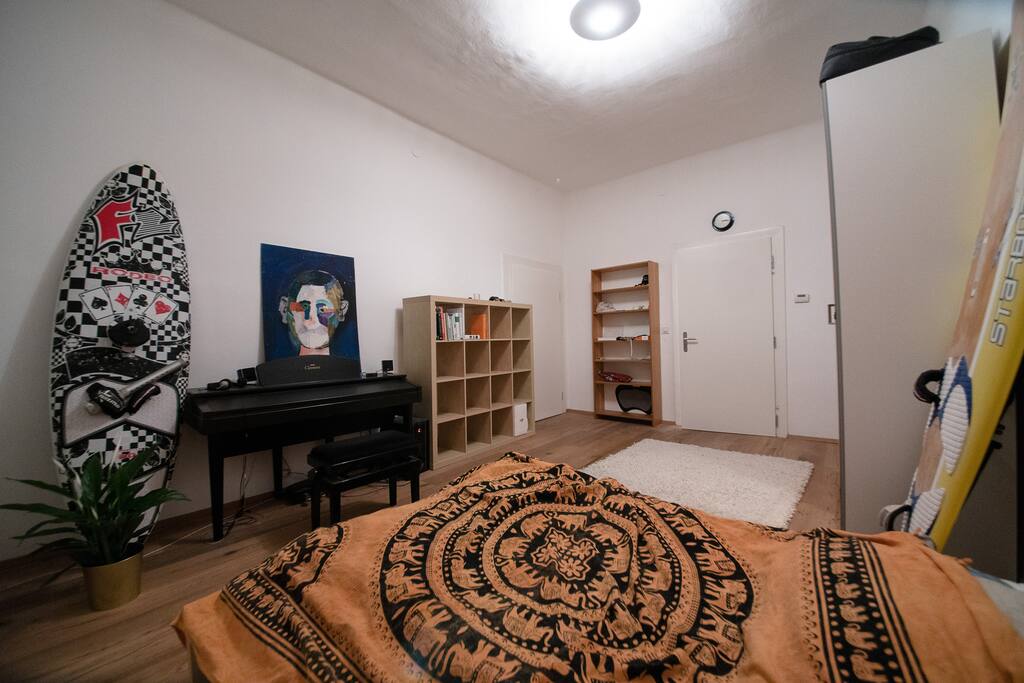 Bed room with doors to bath room (right) and living room (center).