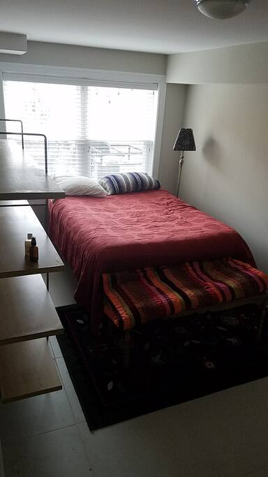 Private bedroom with good natural light and full size bed.