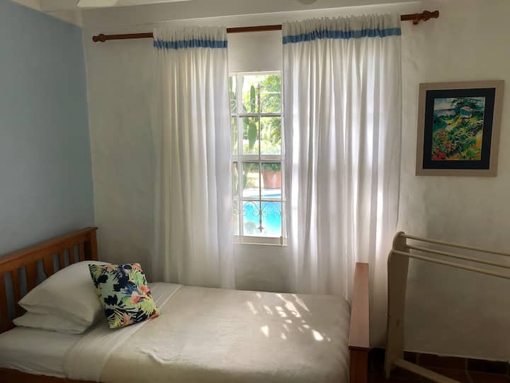 East/West-facing cozy Third Bedroom with pool perspective....