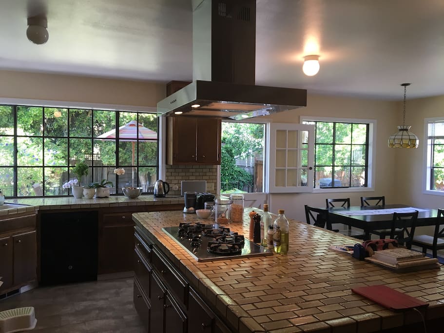 Spacious kitchen with gas burner, dish washer, oven, micro and BBQ on the deck to private back yard.