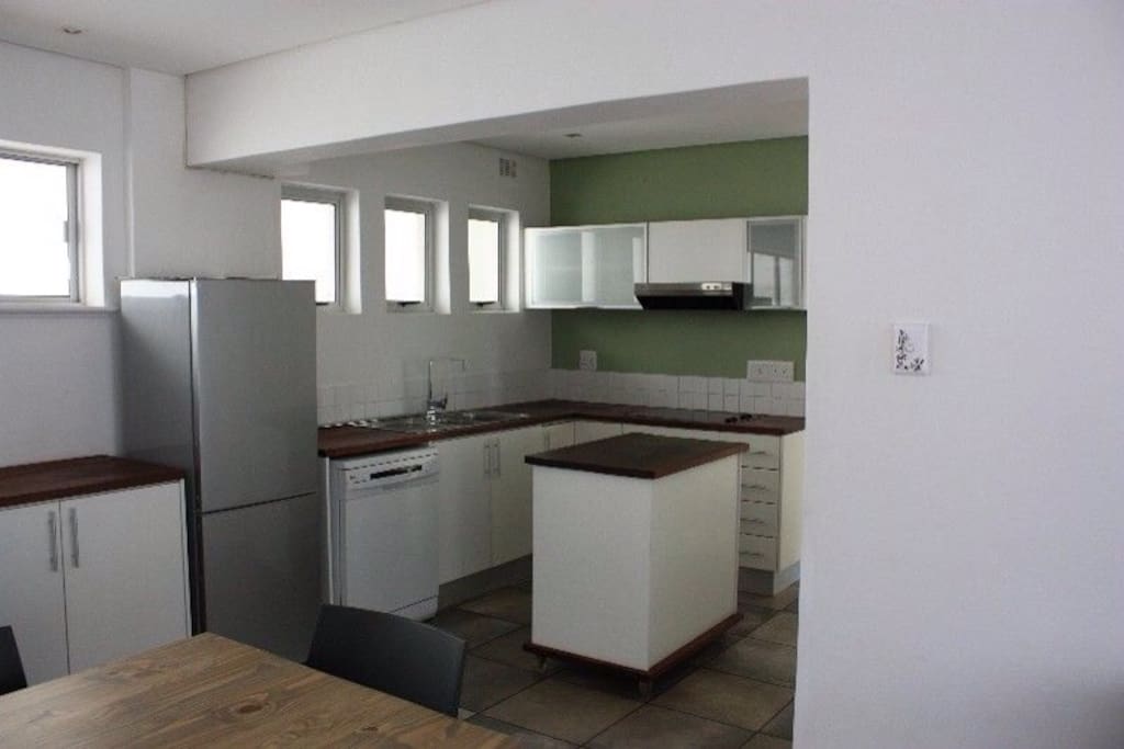 Fully equipped kitchen and 6 seater dining table