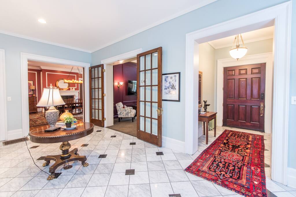 Grand foyer with 11' ceilings and original marble floors