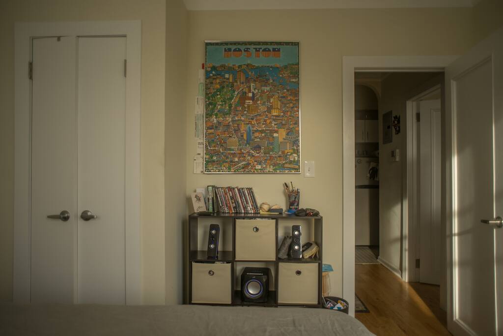 View of bedroom from within, kitchen and living room directly outside.