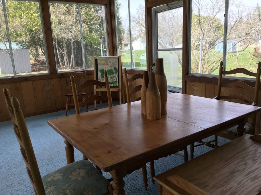 Three-Season Room overlooking vegetable garden in backyard.