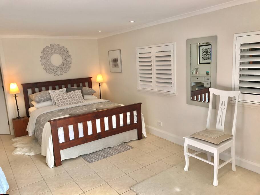 Bedroom 1: Spacious and light with wardrobe and tallboy (not shown).