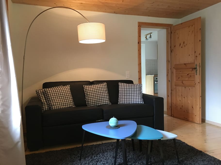 Wohnzimmer mit Schlafsofa für zwei weitere Schlafplätze