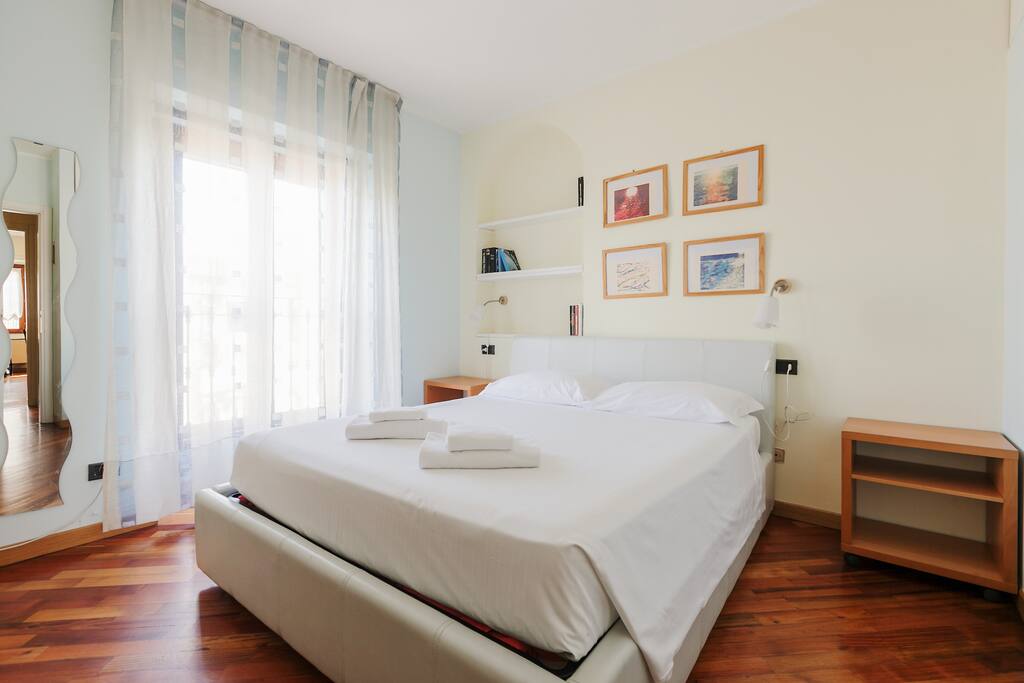 The Bedroom: the comfortable double bed with soft bed-linen and towels.