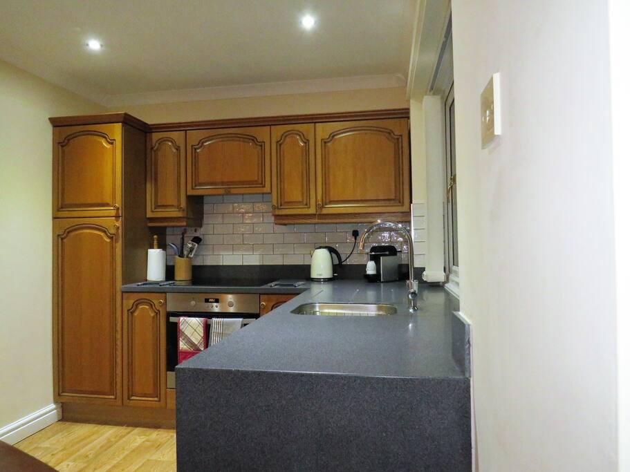 Fully equipped kitchen with induction hob, oven, coffee maker, toaster, kettle, everything you could possibly need