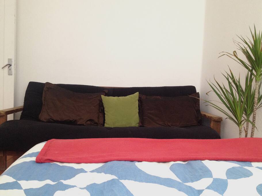 inside the bedroom, there's also a sofa that may be turned into bed.
