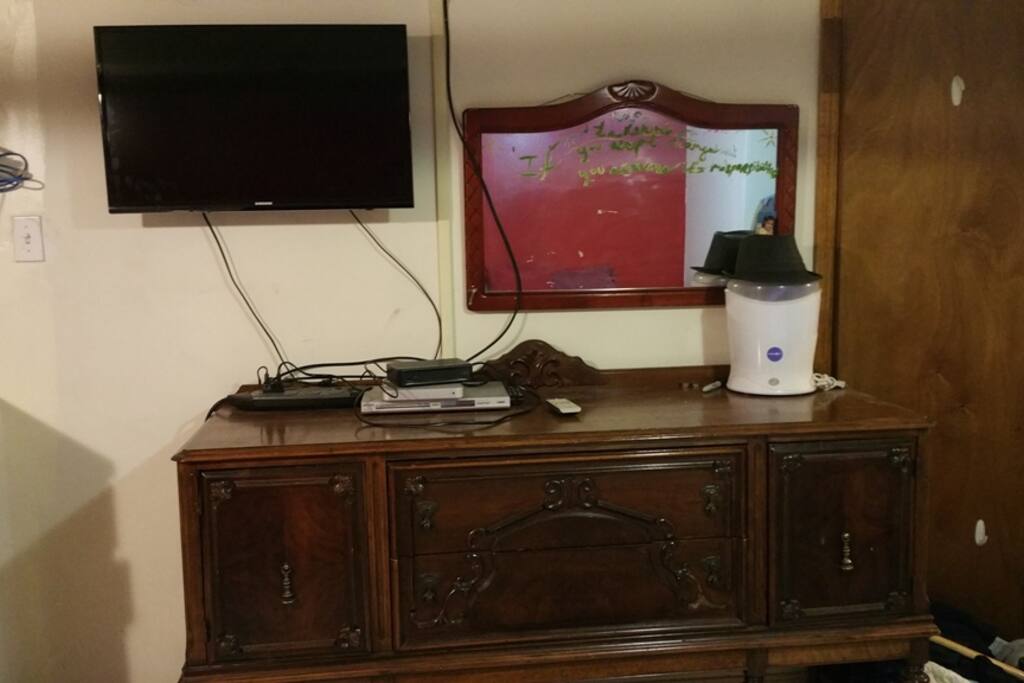 dresser and mounted TV