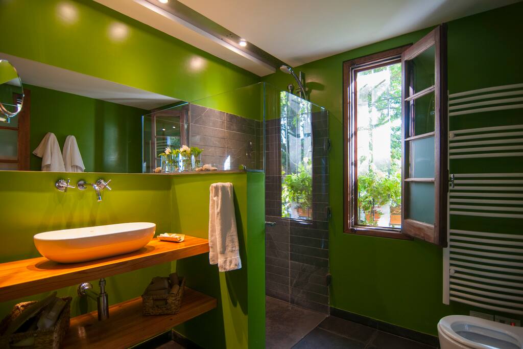 The bathroom has its original wooden window and doors combined with a contemporary design.