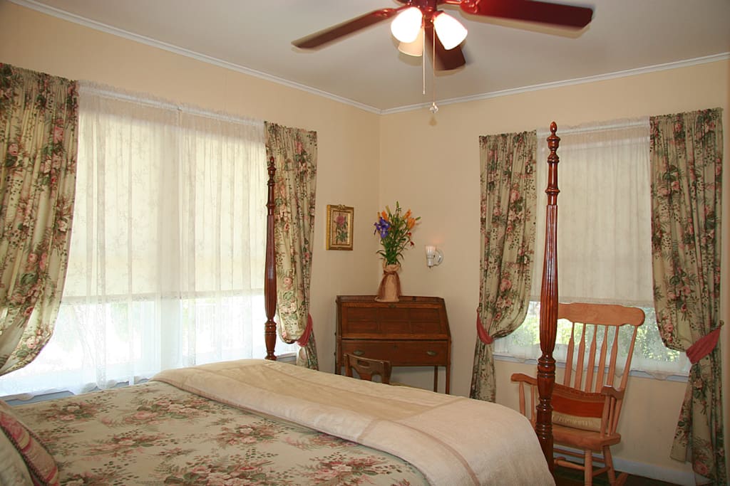 An alternate view of Bedroom 1 (there is now a door where the rocking chair is located which allows guests in this room private access to the exterior). (There is a room and property floor plan later in the slideshow)