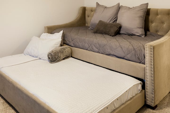 Twin daybed and trundle in 2nd bedroom. Both equipped with a 6 inch comfy memory foam. Extra blankets and pillows availble. Also available is a Pack n' Play and Rollaway Bed kept in this rooms closet. Mamaroo swing, halo bassinest sleeping crib, and