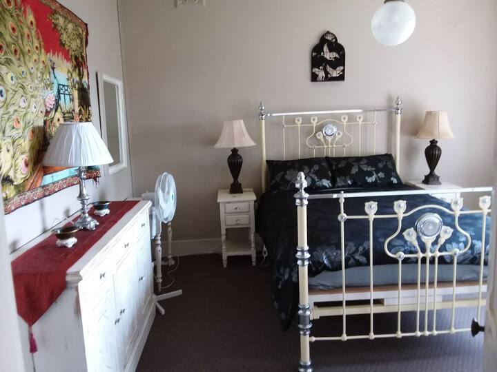 Bedroom 1. Antique queen bed with king size doona. Electric blankets and fans. Very large rooms with double glazing