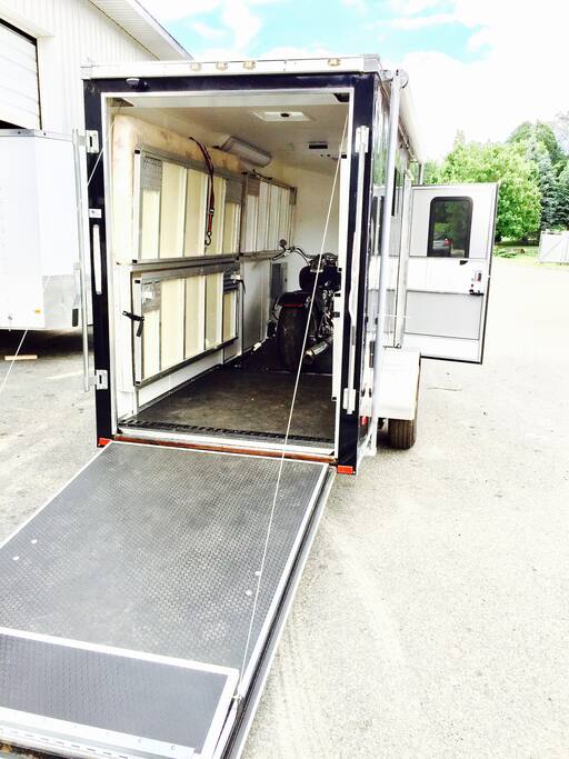 The bunk beds are stored and flip down from the sides leaving room for equipment or motorcycle trailering.