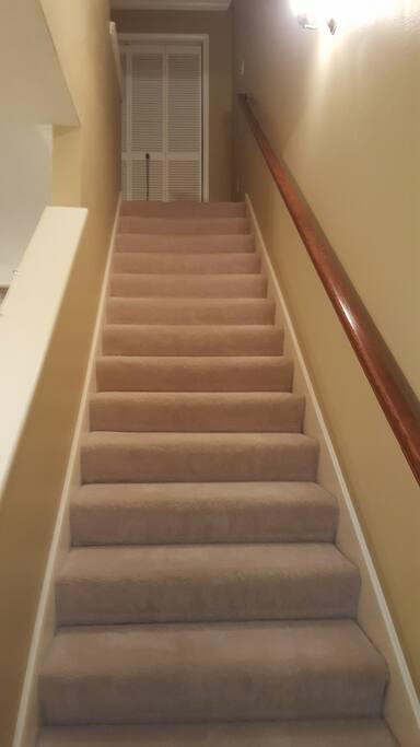 Upon entering the home, the staircase is straight ahead-- leading to the two bedrooms and bathrooms upstairs.