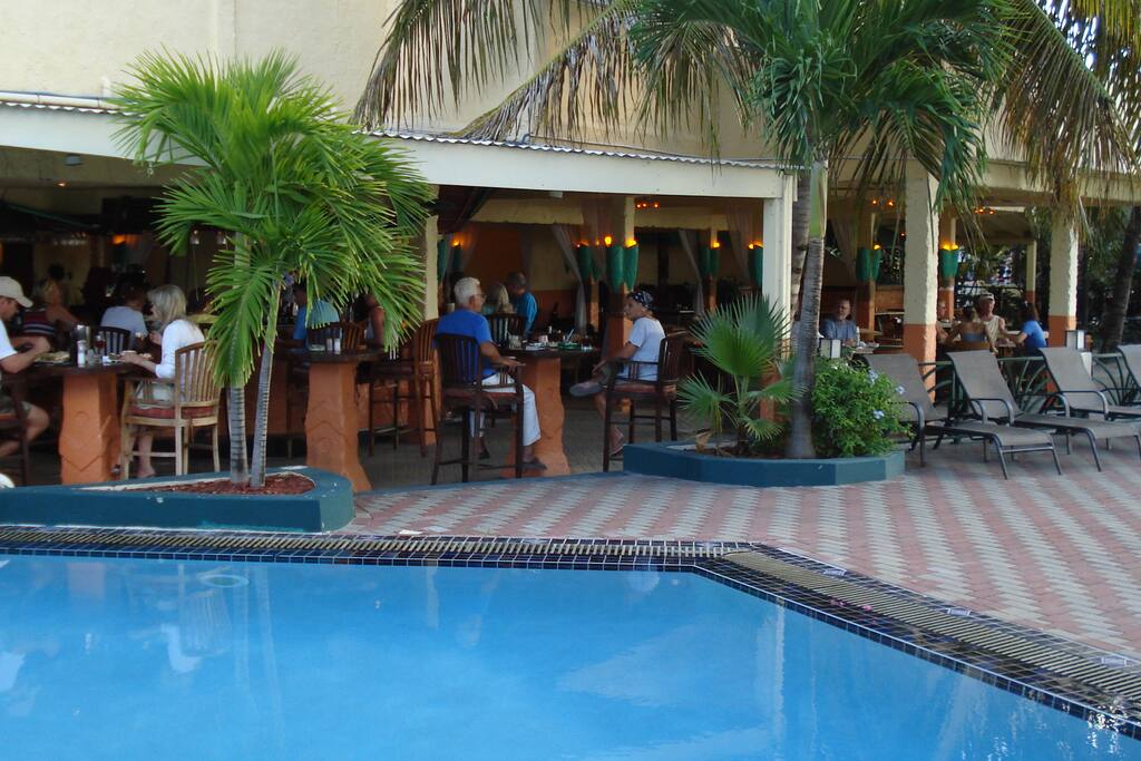 Atrium's pool with adjacent restaurant & Beach bar
