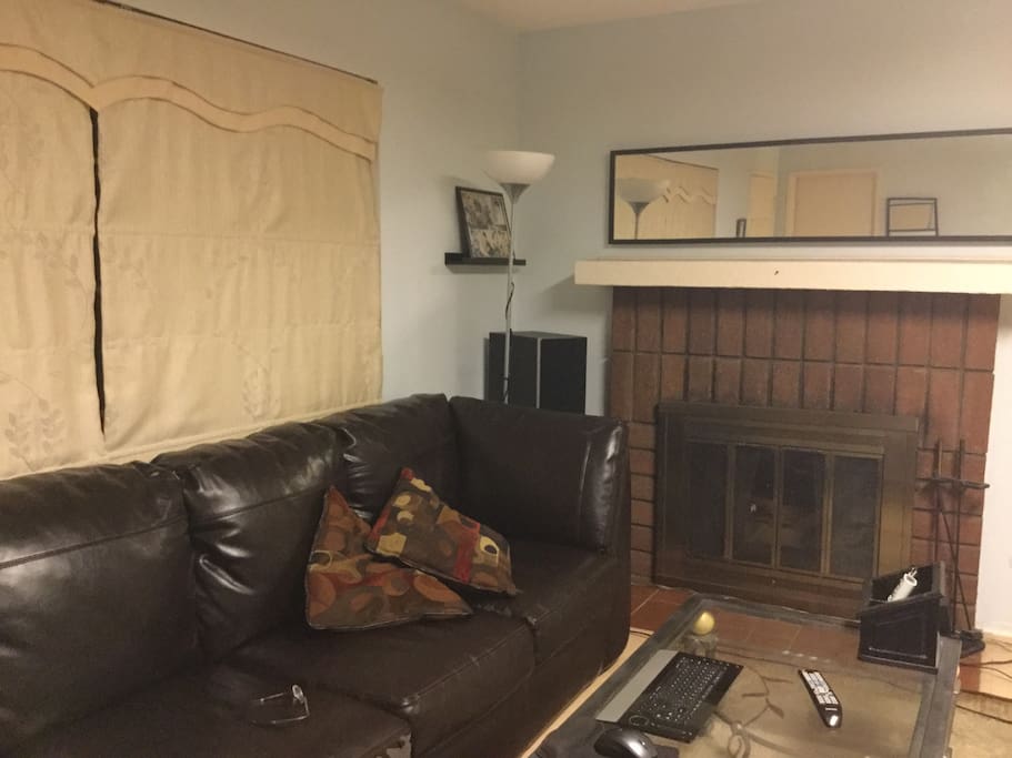 Spacious living room with big screen TV
