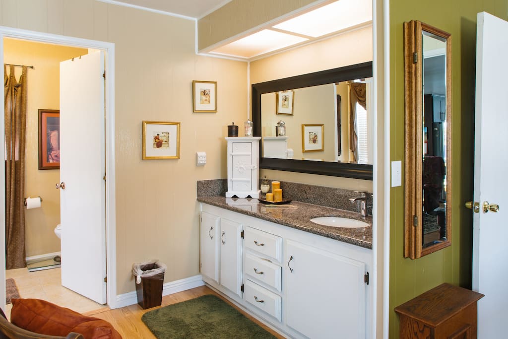 Attached bath with large mirrored closet doors