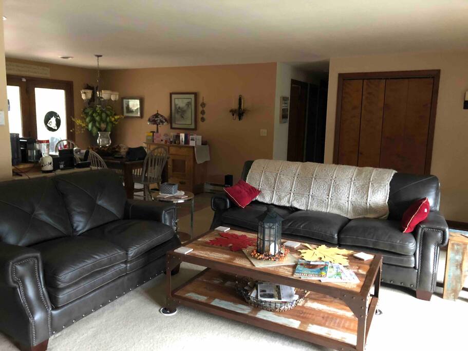 Cozy living room area with a warm pellet stove and TV access.