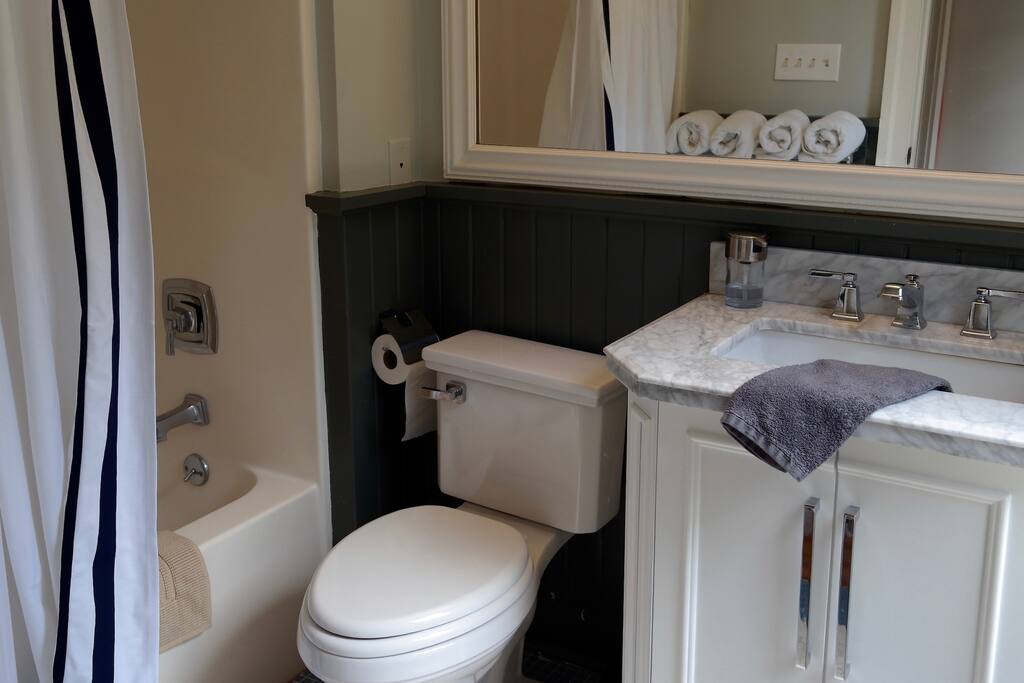 Bathroom, with fresh towels, premium all-natural toiletry products and hairdryer