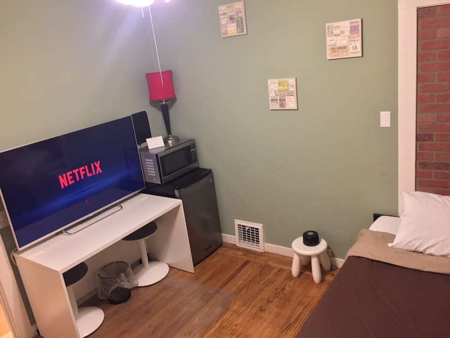 The bedroom features all you need to sleep, work, eat, and relax.