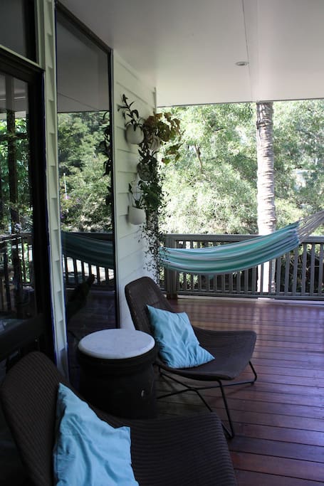 Relax on a chair or hammock looking out to the tree ferns and the palm trees