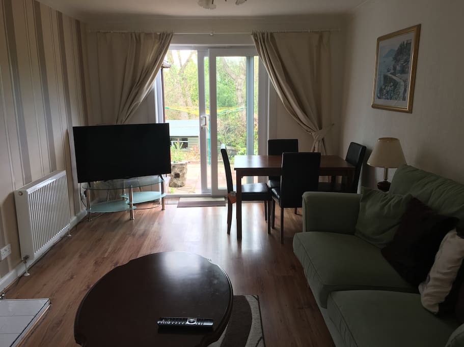 Living and Living/Dining room with 43" Smart TV