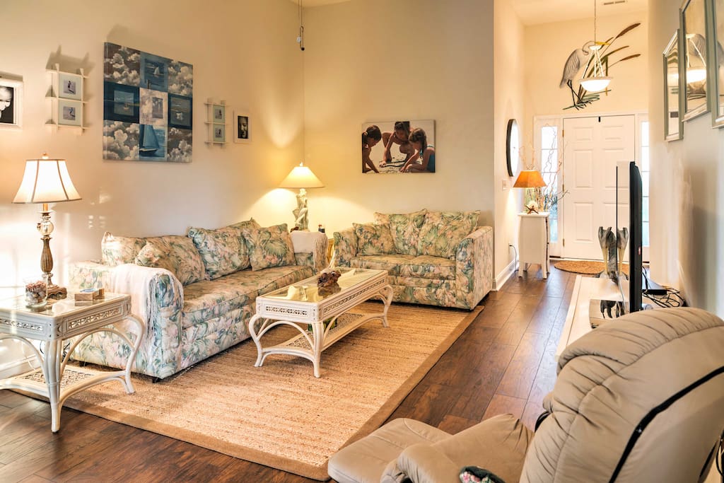 Make yourself at home in this inviting living room, featuring 2 comfortable sofas and a flat-screen cable TV.